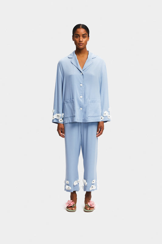 https://eu.the-sleeper.com/cdn/shop/files/SLEEPER_SS2403PCP_The_Bloom_Party_Pajama_Set_with_Pants_in_Blue_SLEEPER_SS2440PM_Poppies_Silk_Kitten_Heel_Mules_in_Mint_and_Pink.jpg?v=1706711693&width=533